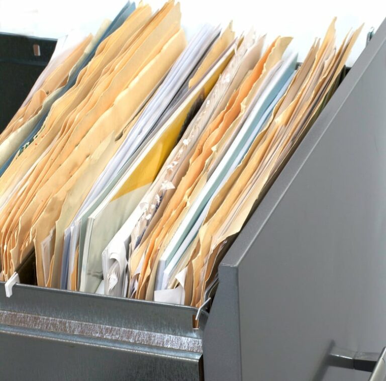 A file cabinet drawer full of files and folders