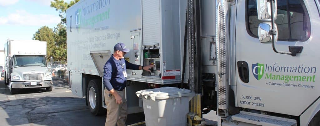 CI Information Management Employee operating a mobile shred truck.