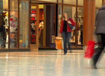 People walking and shopping inside a shopping mall (Blurred motion demonstrates the motion and also protects peoples privacy)