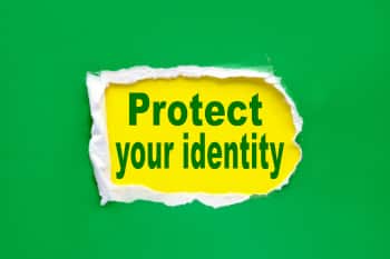 Green Paper being ripped to reveal text that reads "Protect Your Identity"